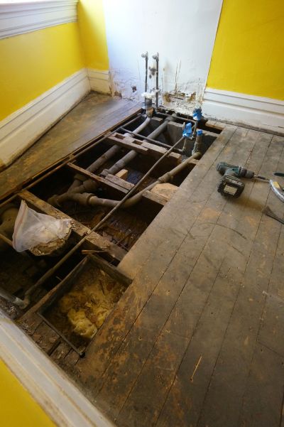The second floor bathroom was fully functioning, I could have left it, but I hated the tile floor and knew the existing plumbing was probably shot. 