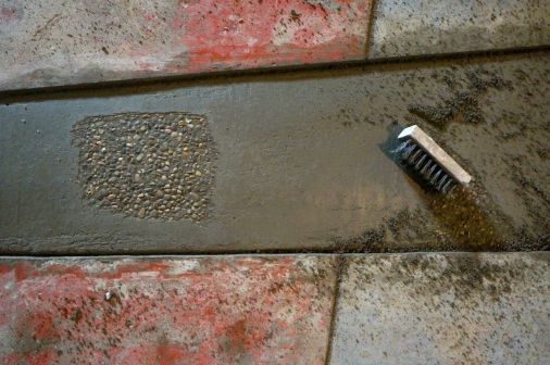 I love the look of exposed aggregate. I worked the cement 'cream' to the top then the next morning wire brushed it off to expose the pea gravel.